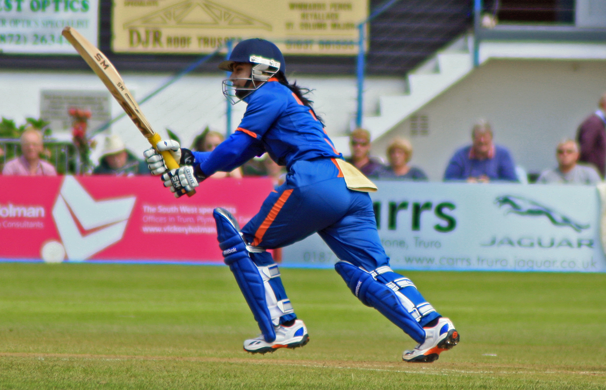 Indian female batsmen hitting a drive
