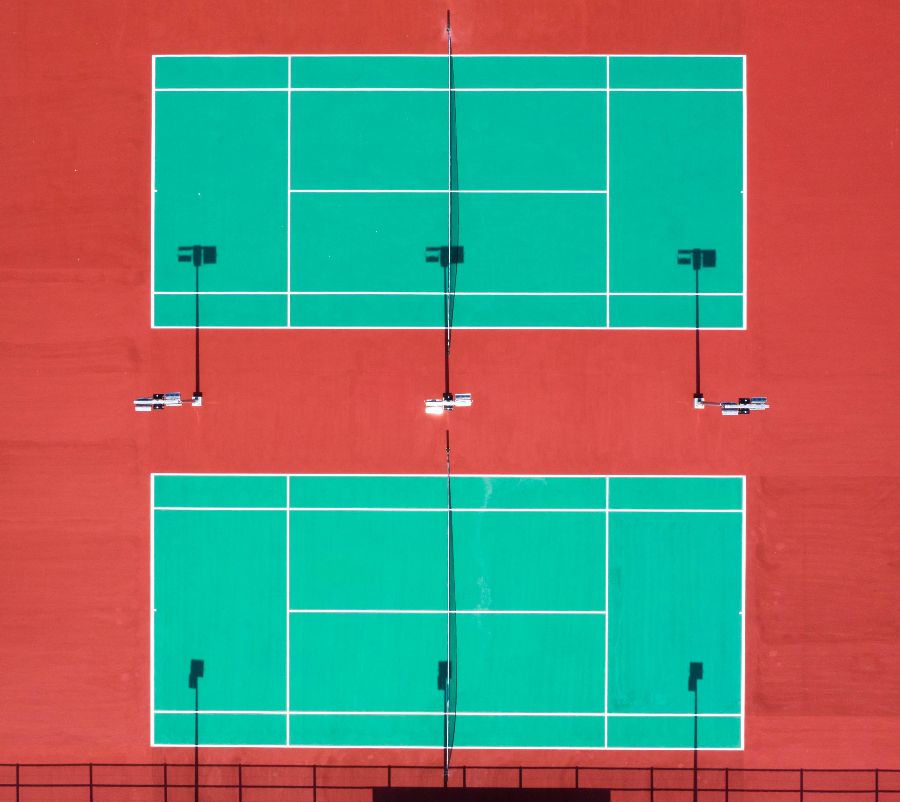 Green tennis courts in Red surface